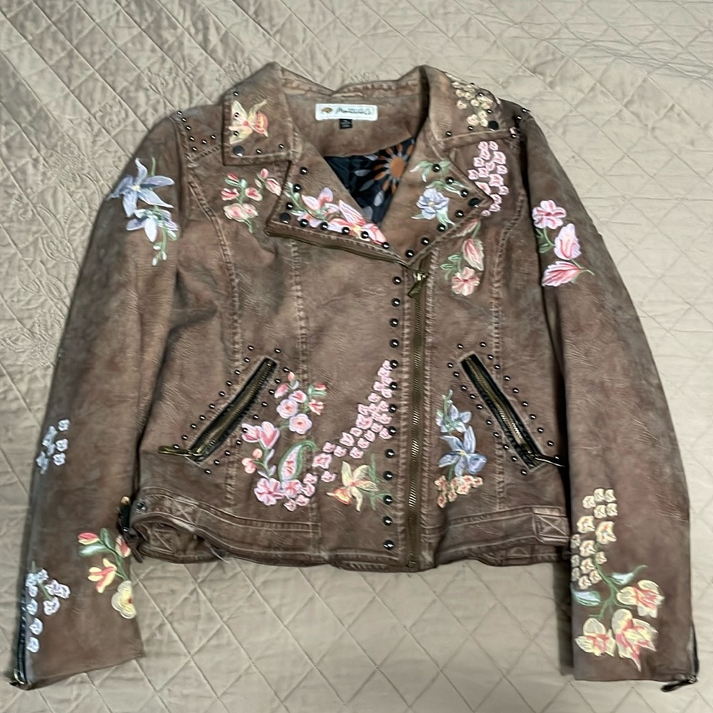 Floral embroidery, leather jacket
